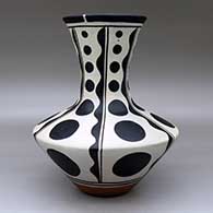 A polychrome vase decorated with a six-panel geometric design, click or tap to see a larger version