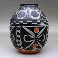 A polychrome jar decorated around the body with a four-panel butterfly and geometric design, and above the shoulder with a geometric design, click or tap to see a larger version