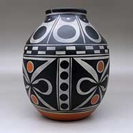 A polychrome jar decorated around the body with a four-panel butterfly and geometric design, and above the shoulder with a geometric design, click or tap to see a larger version