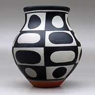 A polychrome jar decorated with a six-panel geometric design, click or tap to see a larger version