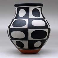 A polychrome jar decorated with a six-panel geometric design, click or tap to see a larger version