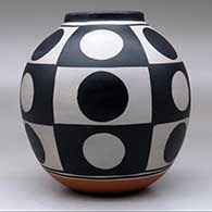 A polychrome jar decorated with a six-panel geometric design, click or tap to see a larger version
