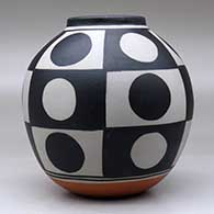 A polychrome jar decorated with a six-panel geometric design, click or tap to see a larger version