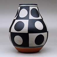 A polychrome jar decorated with a six-panel geometric design, click or tap to see a larger version