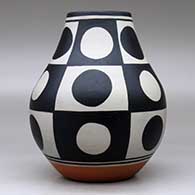 A polychrome jar decorated with a six-panel geometric design, click or tap to see a larger version
