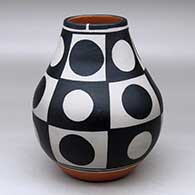A polychrome jar decorated with a six-panel geometric design
 by Thomas Tenorio of Santo Domingo
