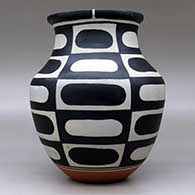 A polychrome jar decorated with a six-panel geometric design, click or tap to see a larger version
