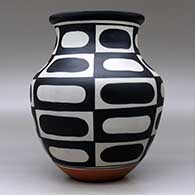 A polychrome jar decorated with a six-panel geometric design, click or tap to see a larger version