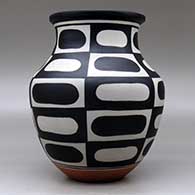 A polychrome jar decorated with a six-panel geometric design, click or tap to see a larger version