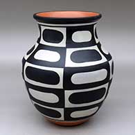 A polychrome jar decorated with a six-panel geometric design
 by Thomas Tenorio of Santo Domingo