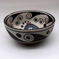 A polychrome chili bowl decorated with a fish and water symbol design inside, and a water symbol design outside, click or tap to see a larger version