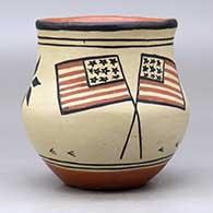 A polychrome jar decorated with a bird, plant and American flag design, click or tap to see a larger version