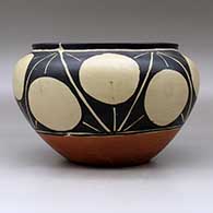 A polychrome bowl with a raised rim and decorated around the shoulder with a geometric design, click or tap to see a larger version