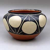 A polychrome bowl with a raised rim and decorated around the shoulder with a geometric design
 by Unknown of Santo Domingo