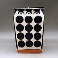 A polychrome rectangular jar decorated with a geometric design, click or tap to see a larger version