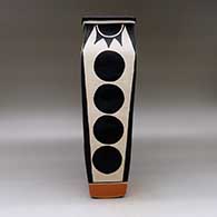 A polychrome rectangular jar decorated with a geometric design, click or tap to see a larger version