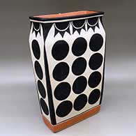 A polychrome rectangular jar decorated with a geometric design
 by Thomas Tenorio of Santo Domingo