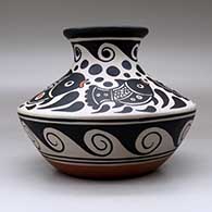 A polychrome low shouldered jar with a short neck and flared rim, all decorated with a fish, water symbol and geometric design, click or tap to see a larger version