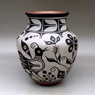A large polychrome jar with a recurved neck and decorated with a bird, plant, flower and geometric design
 by Thomas Tenorio of Santo Domingo