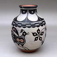 A polychrome jar with a recurved neck and decorated with a bird, flower and geometric design
 by Thomas Tenorio of Santo Domingo