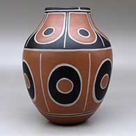 A polychrome jar decorated with bands of geometric design, click or tap to see a larger version