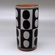 A polychrome cylinder decorated with a six-panel geometric design
 by Thomas Tenorio of Santo Domingo