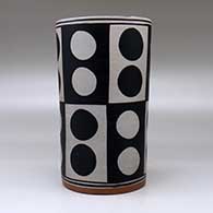 A polychrome cylinder decorated with a six-panel geometric design, click or tap to see a larger version