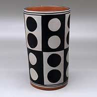 A polychrome cylinder decorated with a six-panel geometric design
 by Thomas Tenorio of Santo Domingo