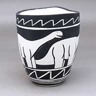 A black on white jar with an organic rim and decorated with an allosaur and geometric design
 by William Pacheco of Santo Domingo