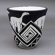 A black on white jar with an organic rim and decorated with an allosaur and geometric design
 by William Pacheco of Santo Domingo