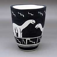 A black on white jar with an organic rim and decorated with an allosaur and geometric design
 by William Pacheco of Santo Domingo