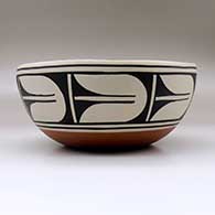 A large chile bowl decorated inside with a bird, plant and geometric design, and outside with a geometric design, click or tap to see a larger version