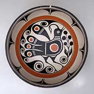 A large chile bowl decorated inside with a bird, plant and geometric design, and outside with a geometric design, click or tap to see a larger version