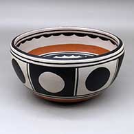 Click for a larger view A large chile bowl decorated inside with a bird, plant and geometric design, and outside with a geometric design
by Thomas Tenorio of Santo Domingo