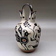 A polychrome wedding vase decorated with a two panel bird, plant, flower and geometric design
 by Thomas Tenorio of Santo Domingo