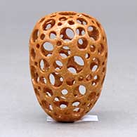 A miniature golden micaceous holey pot, click or tap to see a larger version