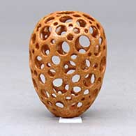 A miniature golden micaceous holey pot, click or tap to see a larger version