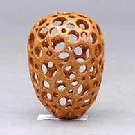 A miniature golden micaceous holey pot, click or tap to see a larger version