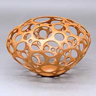 A golden micaceous holey pot, First Prize ribbon from 2025 Heard Museum Indian Arts Fair and Market, click or tap to see a larger version