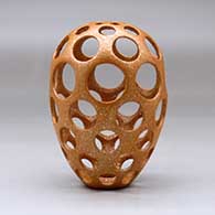 A golden micaceous holey pot, click or tap to see a larger version