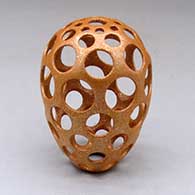 Click for a larger view A golden micaceous holey pot
 by Hubert Candelario of San Felipe