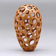 A small golden micaceous holey pot, click or tap to see a larger version