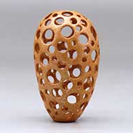 A small golden micaceous holey pot, click or tap to see a larger version