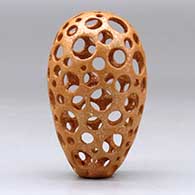 A small golden micaceous holey pot, click or tap to see a larger version