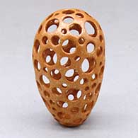 Click for a larger view A small golden micaceous holey pot
 by Hubert Candelario of San Felipe