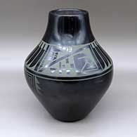 A large green on black jar decorated with a four-panel feather and geometric design around the shoulder
 by Erik Fender of San Ildefonso