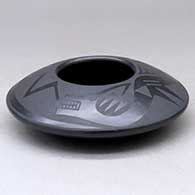 A black on black bowl decorated with an avanyu and pueblo design above the shoulder, click or tap to see a larger version