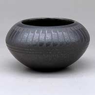 Click for a larger view A black on micaceous black bowl decorated with a band of feathers above the shoulder
 by Johnny Cruz of San Ildefonso