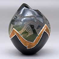 A polychrome jar with an organic opening and shape decorated with a sgraffito duck and bullrushes with inlaid strands of heishi beads and a geometric design, click or tap to see a larger version