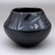 Click for a larger view A black on black jar decorated with a two panel bat wing, kiva step and geometric design
 by Maria Martinez of San Ildefonso